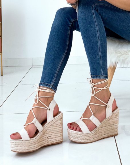 Beige suede wedges with straps and crisscrossed laces