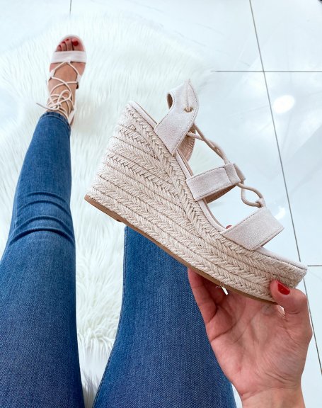 Beige suede wedges with straps and crisscrossed laces