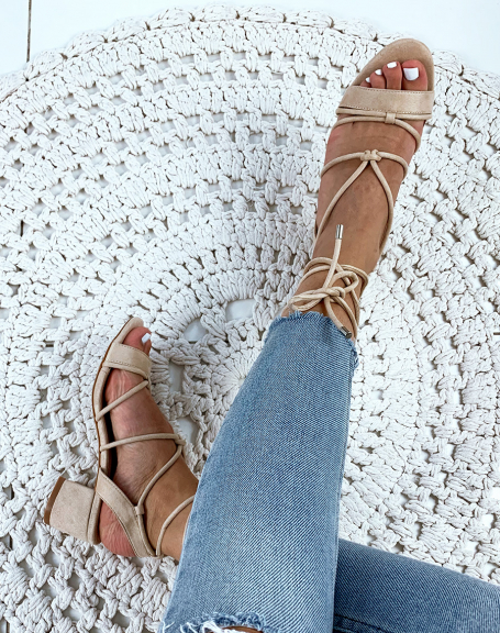 Beige suedette sandals with low heels and ankle laces