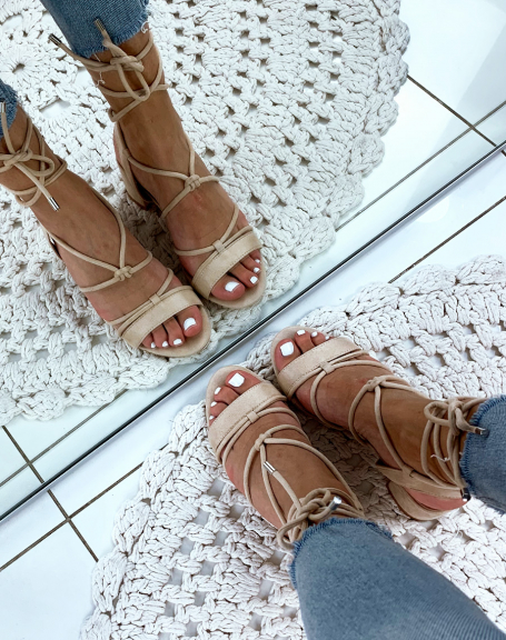 Beige suedette sandals with low heels and ankle laces