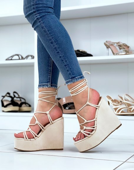 Beige suedette wedges with thin tied straps and laces