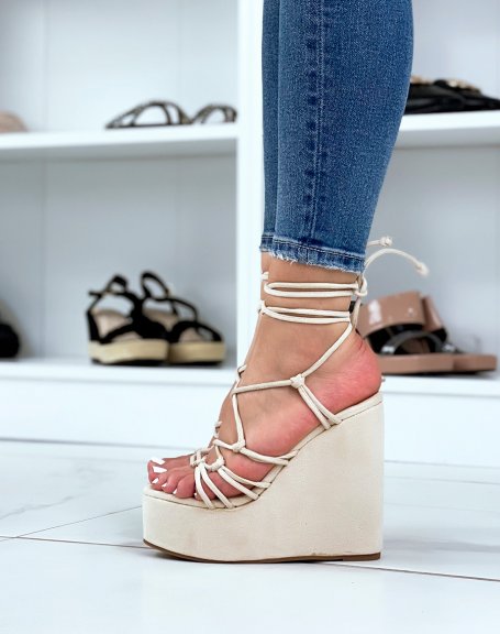 Beige suedette wedges with thin tied straps and laces