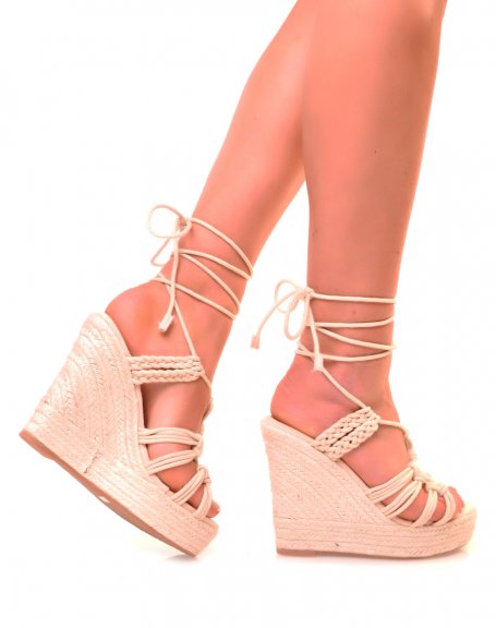 Beige wedges with multiple intersecting straps