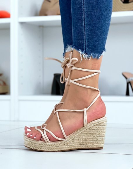 Beige wedges with thin straps and criss-cross laces