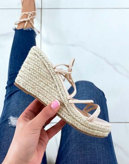 Beige wedges with thin straps and criss-cross laces