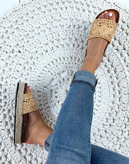 Beige wicker mules with woven patterns and platform