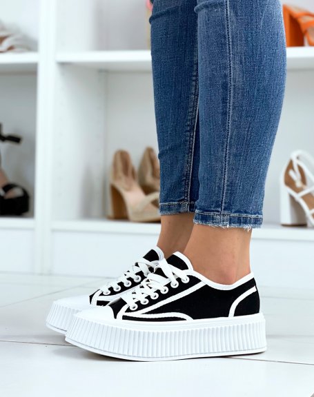 Black and white low-top sneakers with thick sole