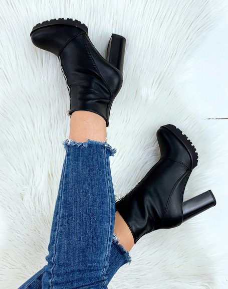 Black ankle boot with zipper at the front