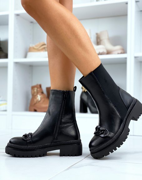 Black ankle boots adorned with a black chain