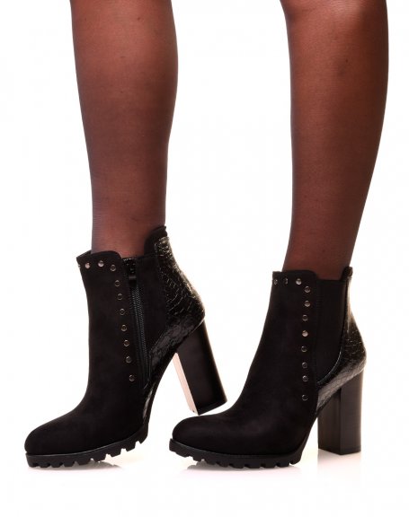Black ankle boots with bi-material heels and studded details