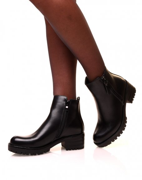 Black ankle boots with decorative closure and lug sole