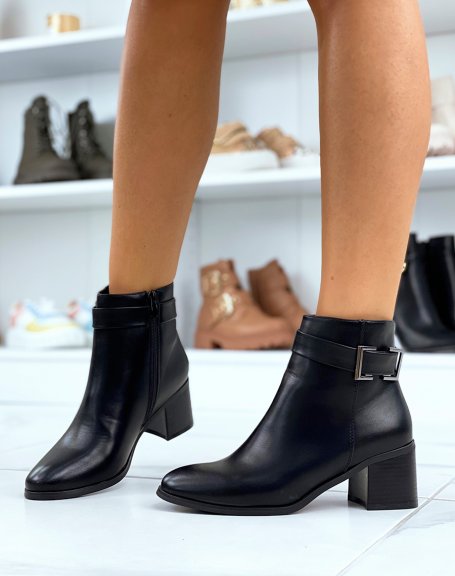 Black ankle boots with heel and decorative square buckle