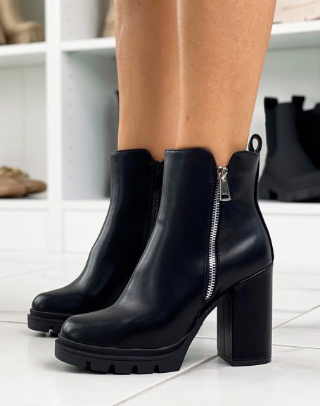 Black ankle boots with heel and silver zip detail