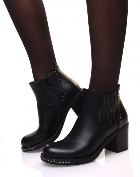 Black ankle boots with heels adorned with small round studs