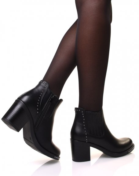 Black ankle boots with heels adorned with small round studs