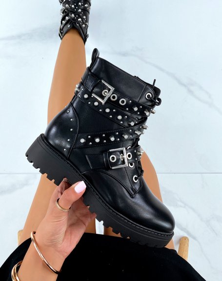 Black ankle boots with laces and multiple decorated straps