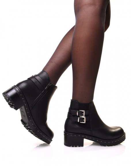 Black ankle boots with lugged and studded sole
