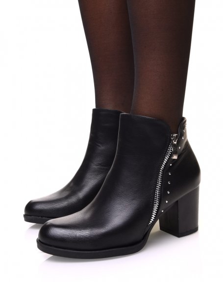 Black ankle boots with mid-high heel and decorative closure