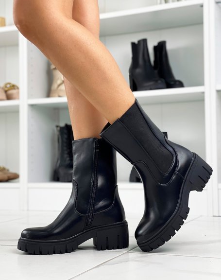Black ankle boots with notched sole