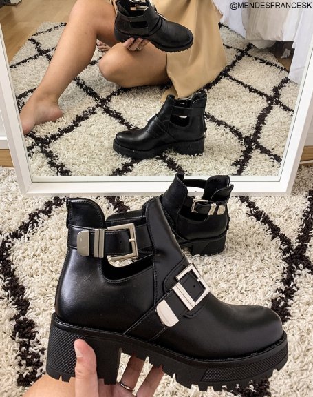 Black ankle boots with notched soles and double straps