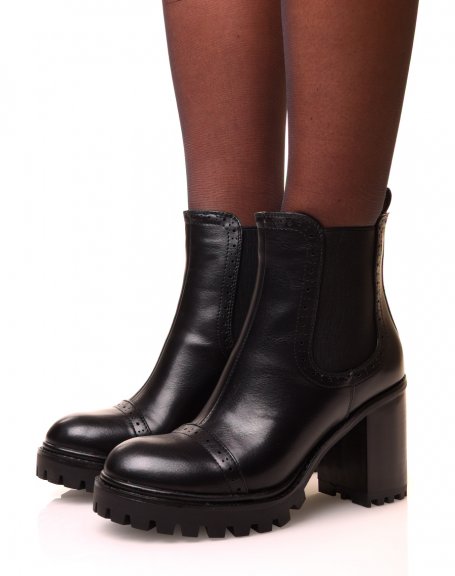 Black ankle boots with square heels and notched soles