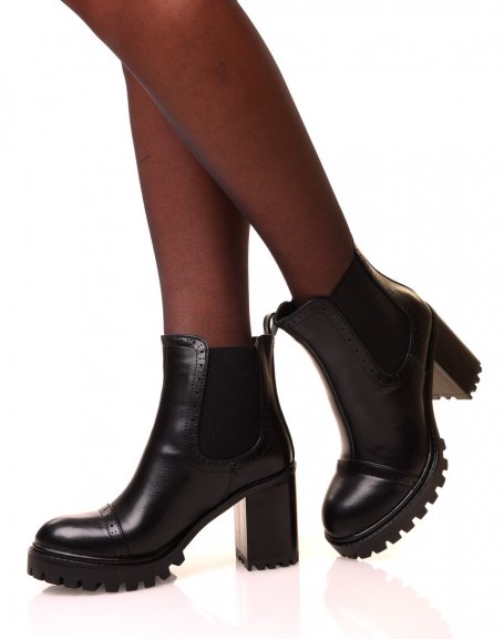Black ankle boots with square heels and notched soles