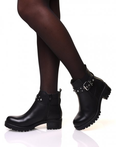 Black ankle boots with straps adorned with rhinestones and small studs