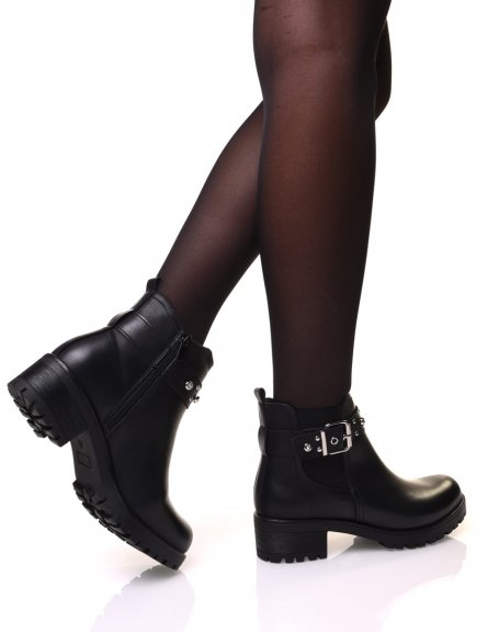 Black ankle boots with straps adorned with rhinestones and small studs