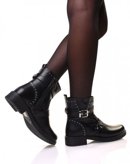 Black ankle boots with straps and adorned with small round studs