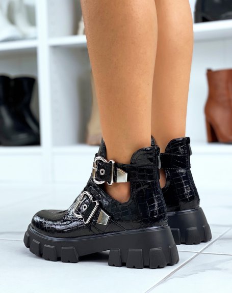 Black ankle boots with straps and notched croc-effect soles