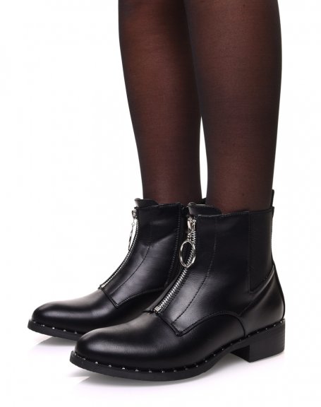 Black ankle boots with studded sole and decorative zipper at the front
