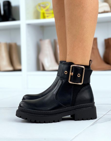 Black ankle boots with thick and golden strap