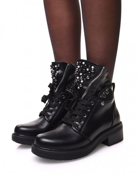 Black ankle boots with zipped and beaded tongue