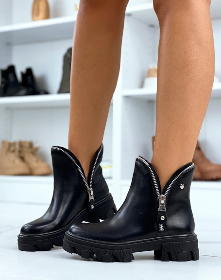 Black ankle boots with zipped petal effect and notched sole