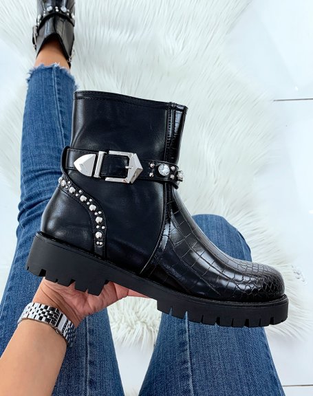 Black bi-material ankle boots adorned with studs
