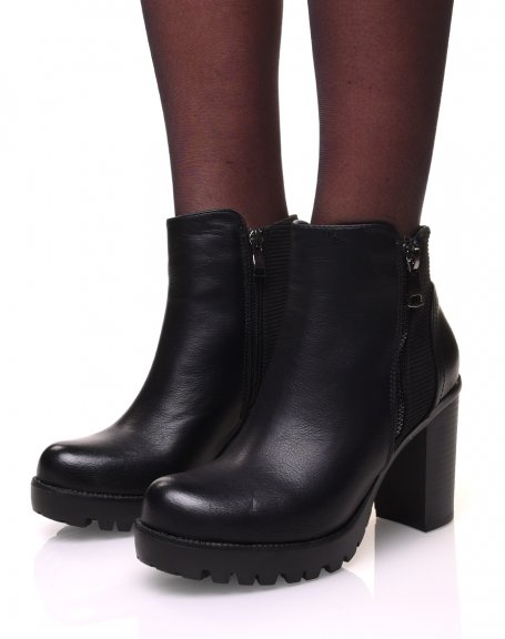 Black bi-material heeled boots and notched platforms