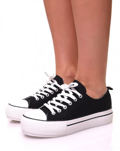 Black canvas sneakers with platforms decorated with trims