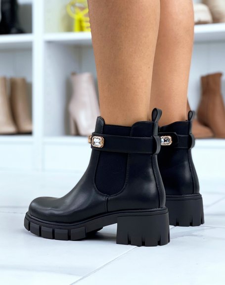 Black Chelsea boots adorned with jewels