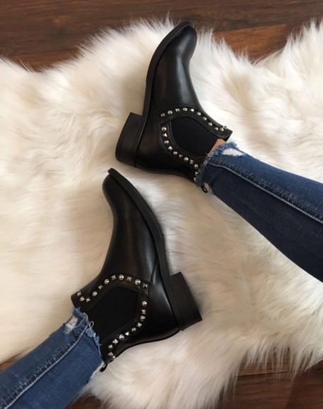 Black Chelsea boots adorned with studs