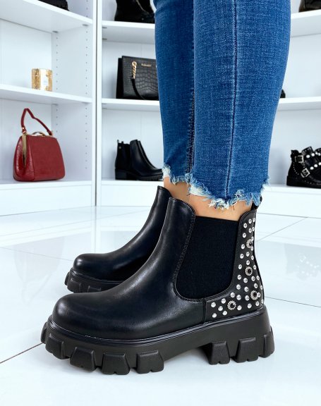 Black Chelsea boots with embellishments and notched soles