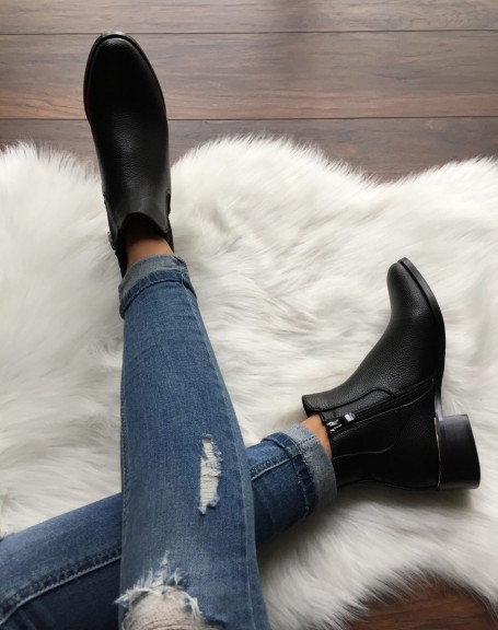 Black Chelsea boots with gold piping
