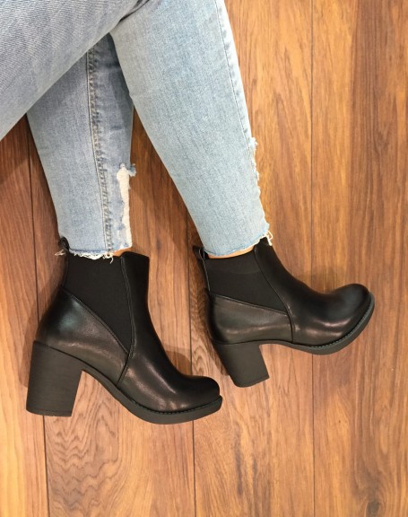 Black Chelsea boots with heels