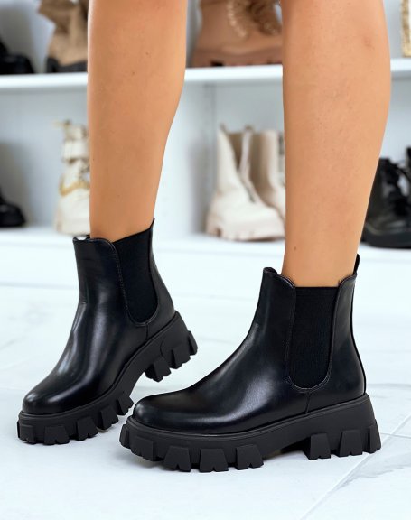 Black Chelsea boots with large, thick, lugged sole