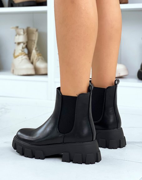 Black Chelsea boots with large, thick, lugged sole
