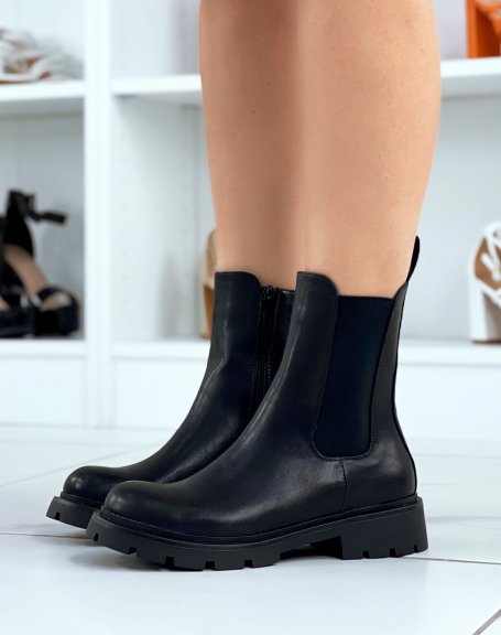 Black chelsea boots with notched sole