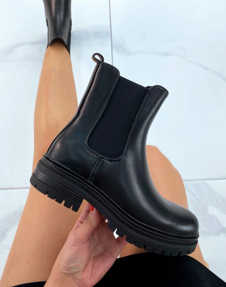 Black Chelsea boots with thin notched sole