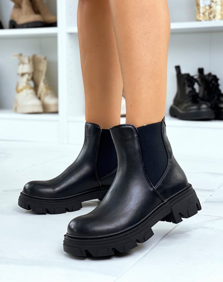 Black Chelsea-inspired ankle boots with heel and lug sole