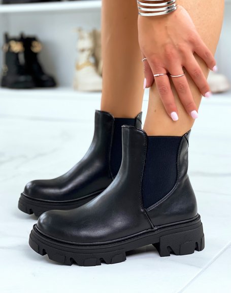 Black Chelsea-inspired ankle boots with heel and lug sole