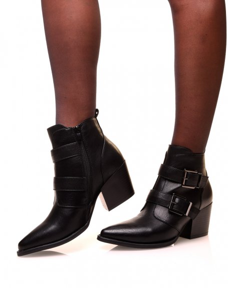 Black cowboy boots with heels and pointed toes