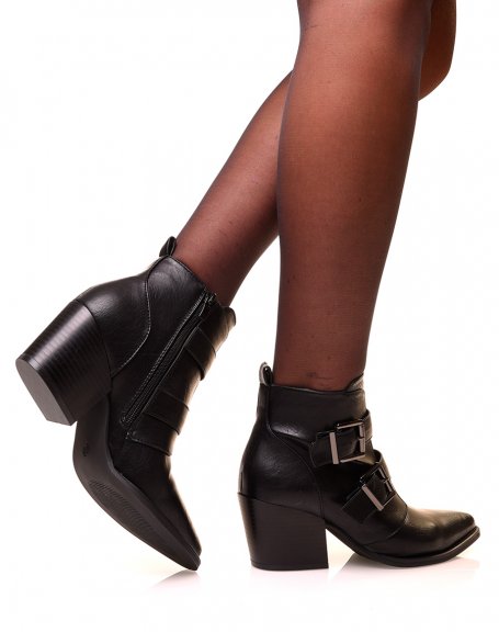 Black cowboy boots with heels and pointed toes